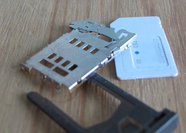 A SIM card cage on a table