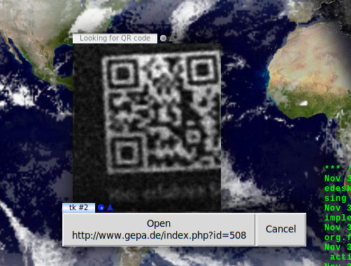 Screenshot: Two windows.  One contains a photo of a QR code, the other two buttons, one for opening the URI parsed from the QR code, the other for canceling and scanning on.