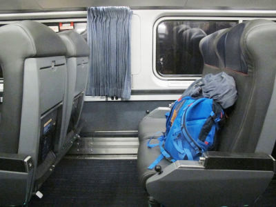 Seats of a train carriage, where the distance to the next row is of the order of airline first class.