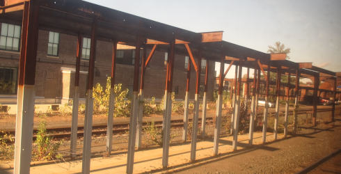 A rusty steel pergola