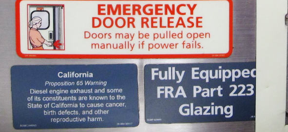 Several official stickers, one of them saying: “California Proposition 65 warning: Diesel engine exhaust and some of its constituents are known to the State of California to cause cancer, birth defects, and other reproductive harm.“