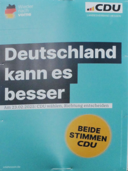 Wahlplakat "Deutschland kann es besser" auf blauem Grund, schwarzrotgelbe Silhouette, daneben "wieder nach vorne"