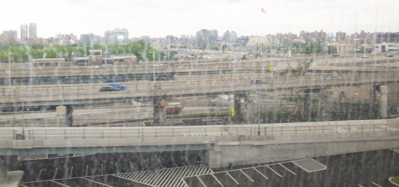 Lots of roads, elevated or otherwise, with some larger buildings behind them.