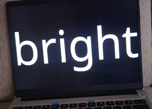 A notebook screen showing the word "bright".